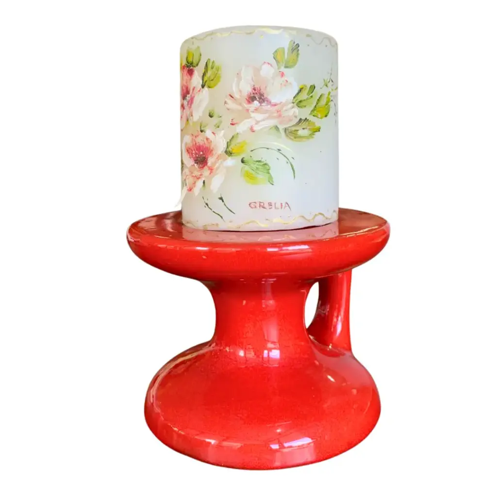 Vela con base roja